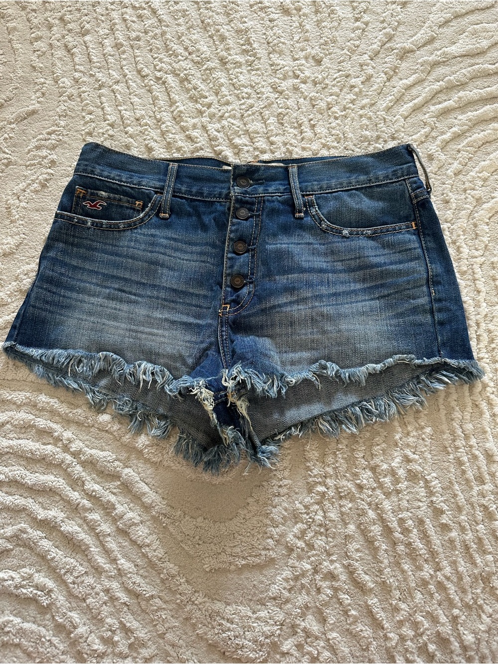 Hollister Button-Front Distressed Denim Cutoff Shorts in Blue